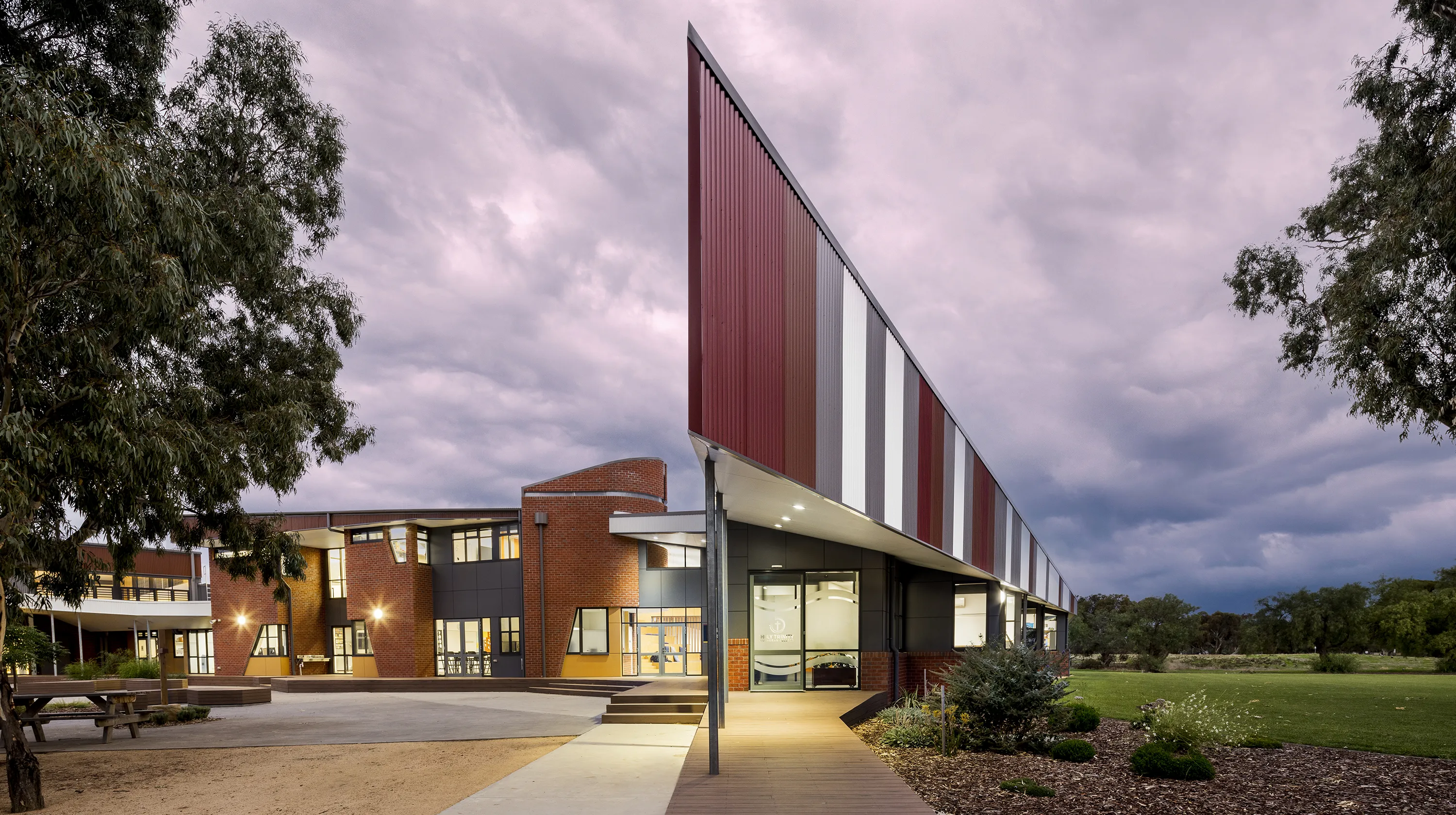 Holy Trinity Lutheran College Horsham building with a distinctive covered walkway, landscaped grounds, and open outdoor gathering spaces.