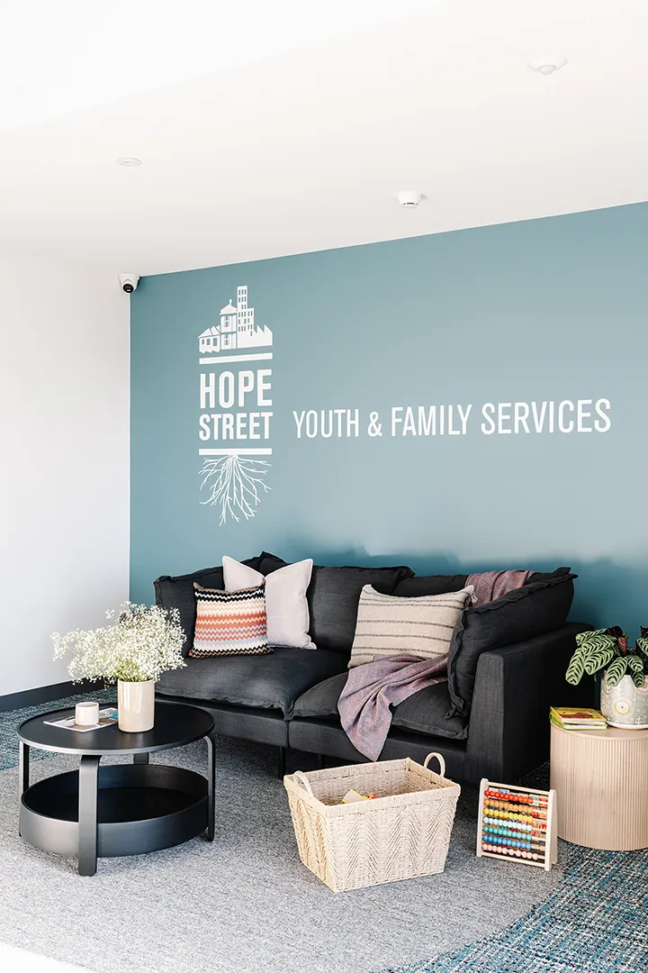 Comfortable lounge area with seating, children's activities, and a welcoming space for young people and families.
