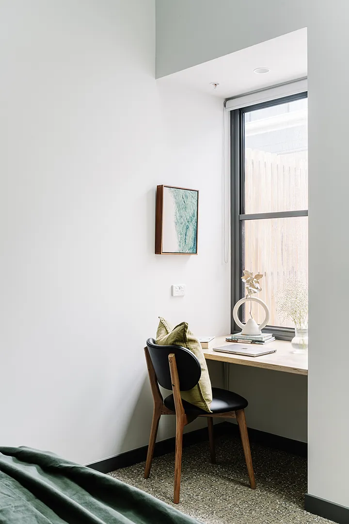 Private study area with a desk, chair, and natural light providing a quiet space for work or study.