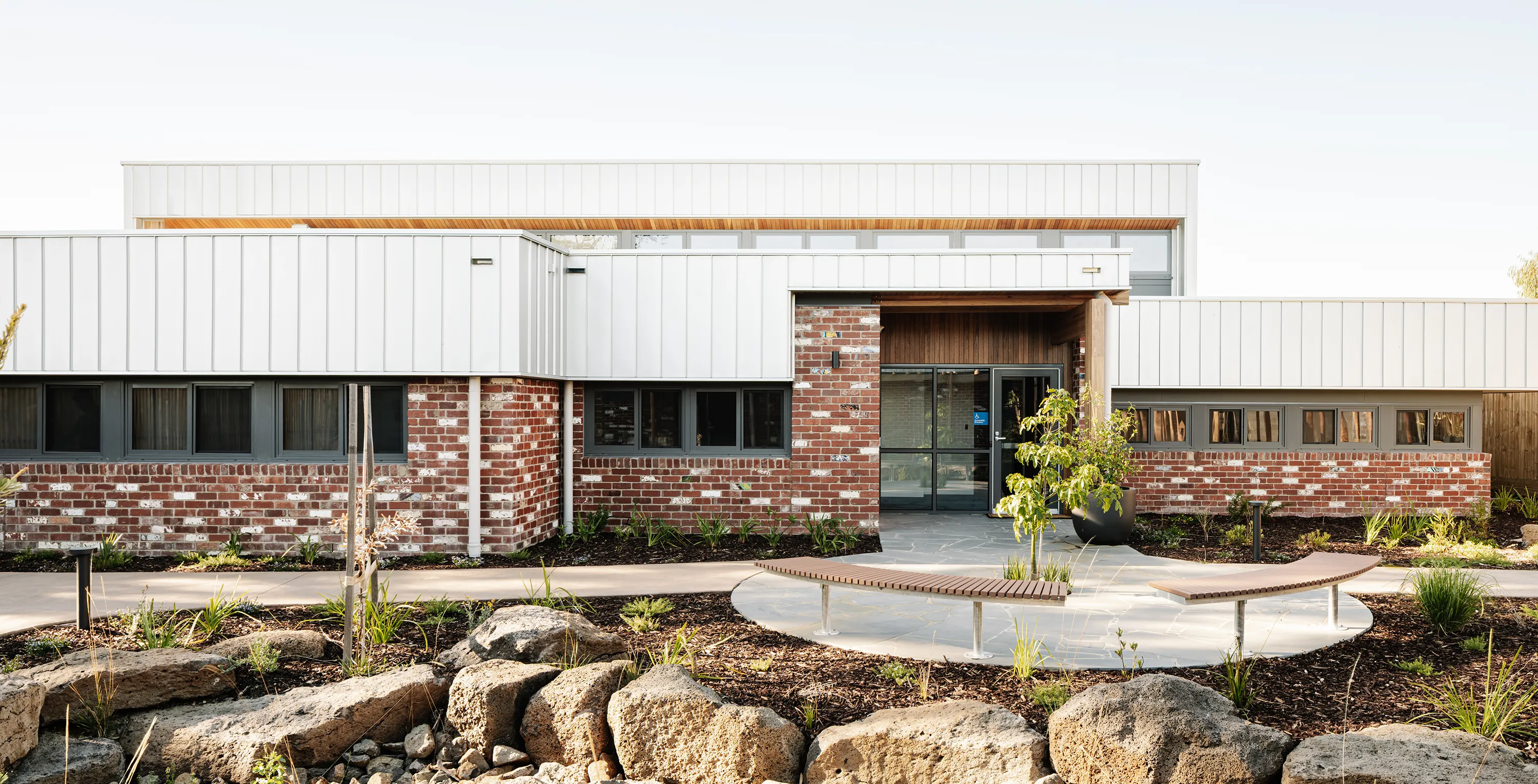 Hope Street First Response Youth Service Refuge Whittlesea featuring landscaped gardens, outdoor seating, and a welcoming entrance courtyard.