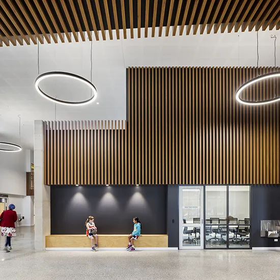 Indoor waiting and gathering area with seating, meeting rooms, and open spaces for visitors to connect and relax.