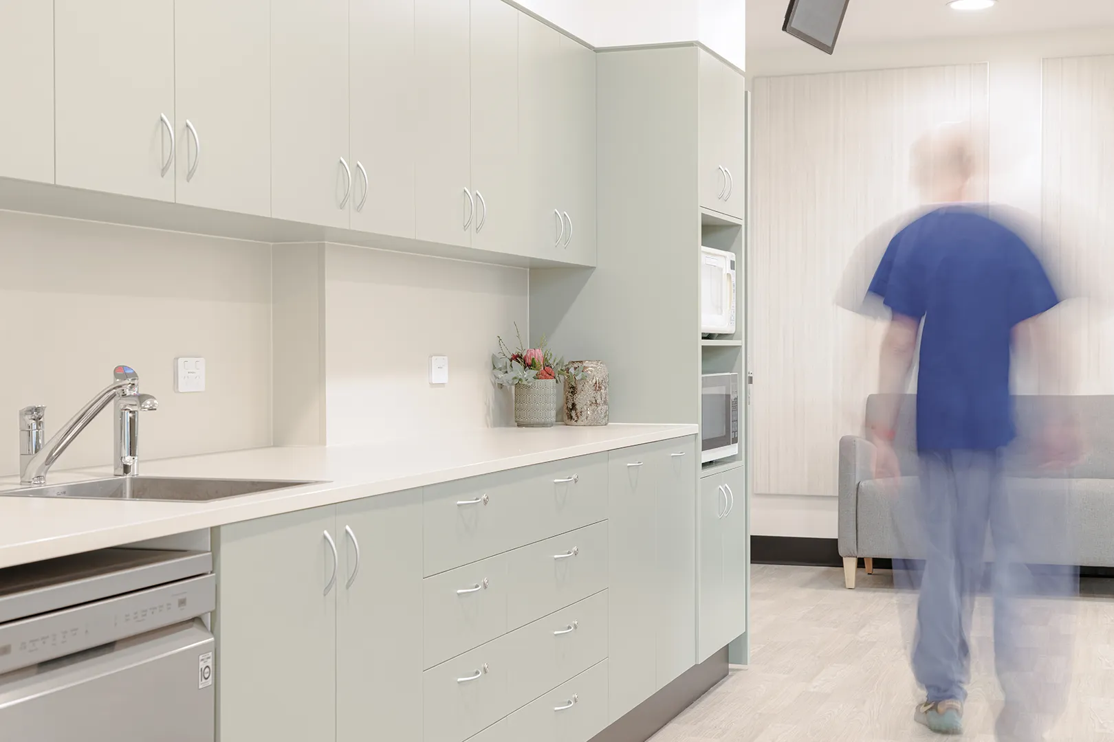 New staff amenities space incorporating a kitchenette and quiet retreat area created to enhance staff comfort and operational efficiency.